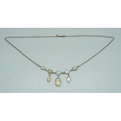 1084 - An opal necklet, (tests as silver)