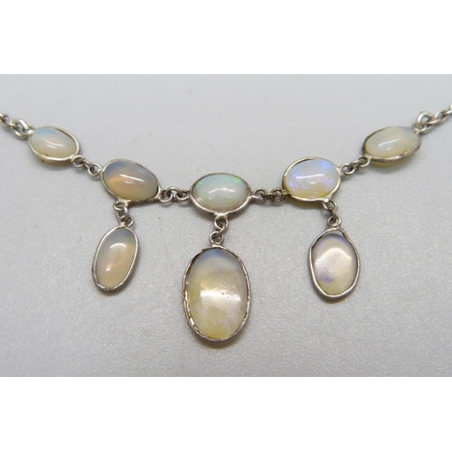 1084 - An opal necklet, (tests as silver)