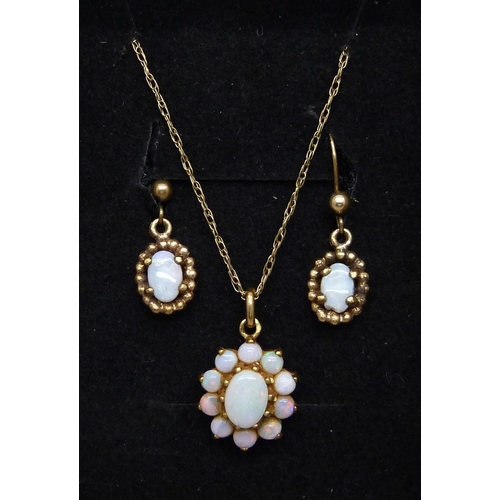 1090 - A 9ct gold and opal pendant and chain, and a pair of 9ct gold and opal earrings, 3.5g