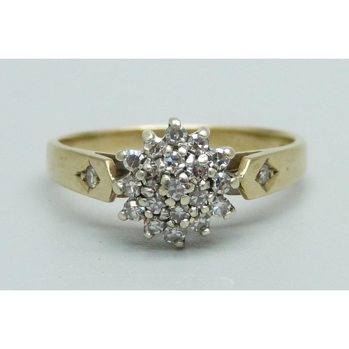 1095 - A 9ct gold, diamond cluster ring with diamond set shoulders, 2.1g, N