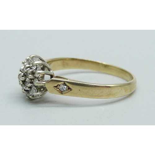 1095 - A 9ct gold, diamond cluster ring with diamond set shoulders, 2.1g, N