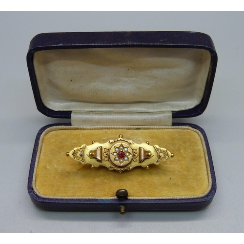 1100 - A 9ct gold, ruby and pearl brooch, a/f, Chester 1918, 3g, boxed