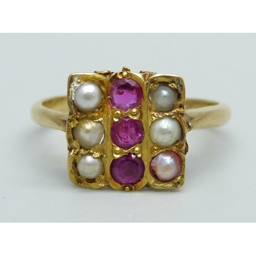 1103 - A ruby and half pearl ring, marked 21K, 3.2g, L