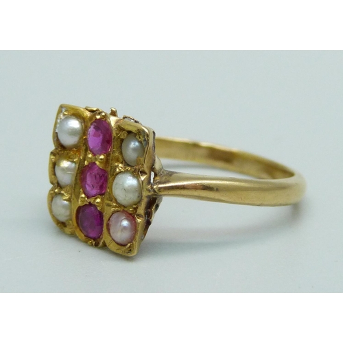 1103 - A ruby and half pearl ring, marked 21K, 3.2g, L