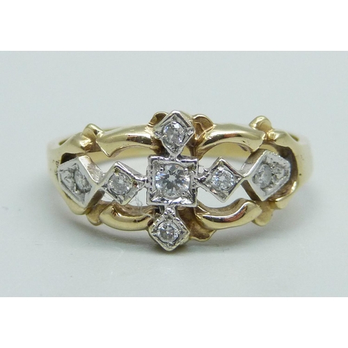 1105 - A 9ct gold and seven stone diamond cluster ring, 3.1g, R