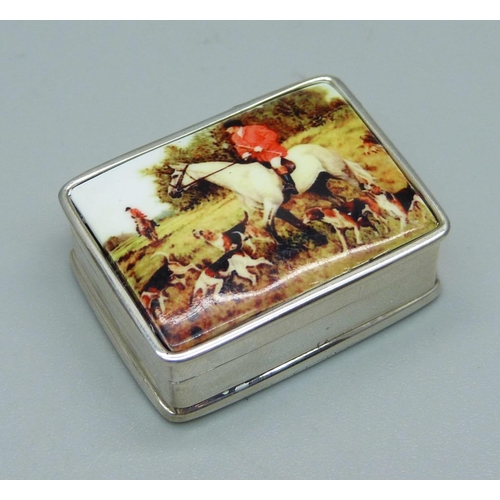 1110 - A silver and enamel pill box with hunting scene detail