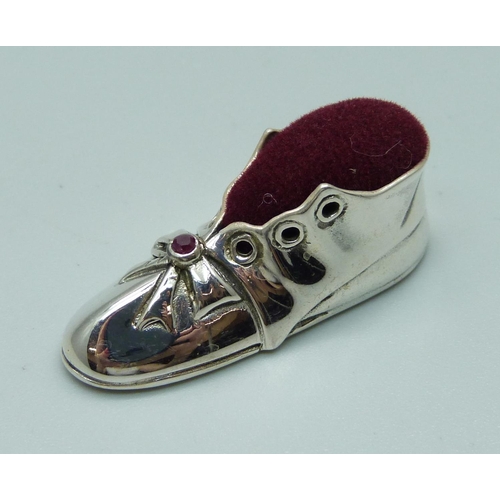 1112 - A small novelty silver boot pin cushion