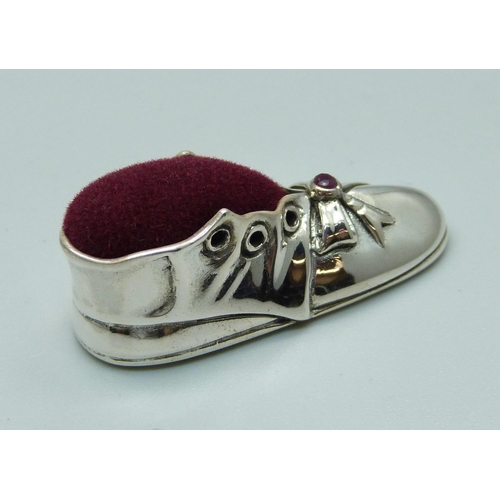 1112 - A small novelty silver boot pin cushion