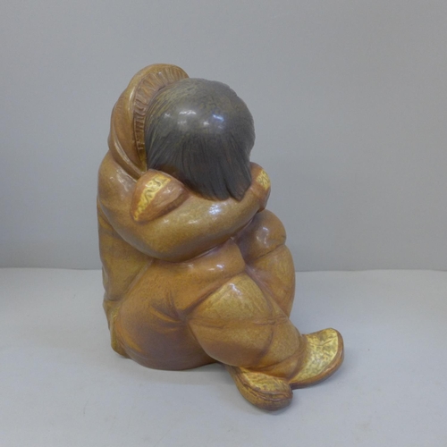 601 - A Lladro figure of a sleeping Inuit boy, 26cm