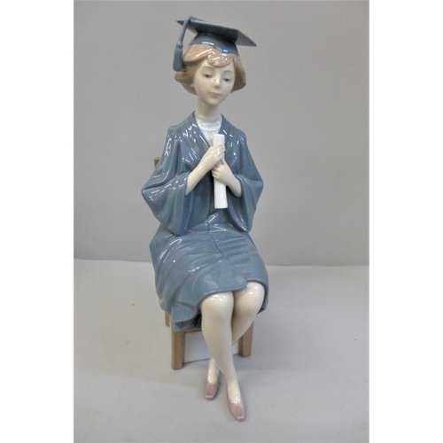 602 - A Lladro figure of a Girl Graduate, 26.5cm