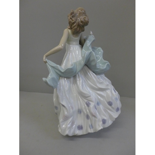 604 - A Lladro figure of a woman with bird, Summer Serenade, 31.5cm