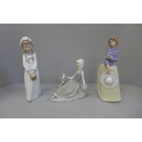 611 - A Lladro figure and two Nao figures