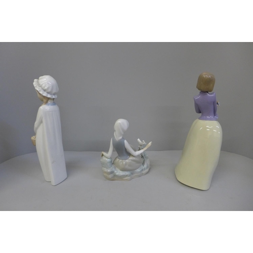 611 - A Lladro figure and two Nao figures