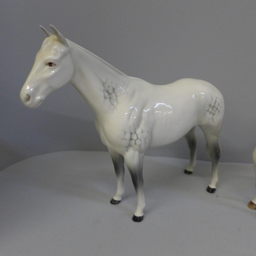 614 - Three Beswick dapple grey horses, smallest with one back leg restored and largest with one front leg... 