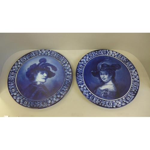 617 - A pair of Royal Blue Delft portrait plates, after Rembrandt, 32cm