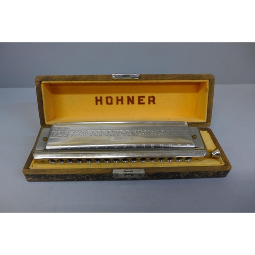 619 - A Hohner The 64 harmonica, cased