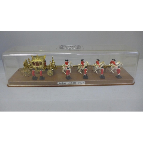 638 - A model of a Queen Elizabeth II Silver Jubilee 1977 coach and horses in a perspex case