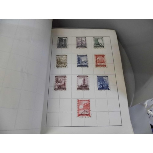 656 - Three albums of stamps including some Victorian penny reds, Worldwide, Japan, Ethiopia, etc.