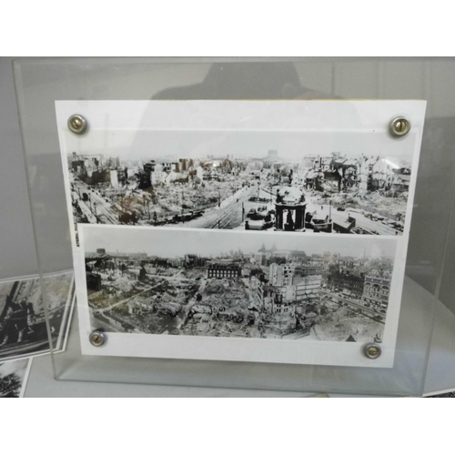 668 - Two black and white photographs of the Liverpool blitz, Adolf Hitler album cards and other photograp... 