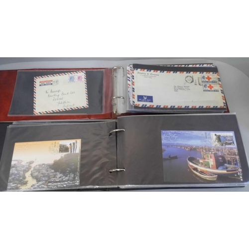 675 - Stamps; Hong Kong postal history, maxi-cards, etc., in two albums