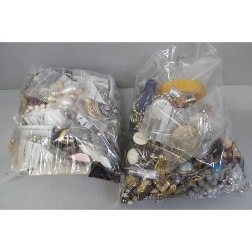 688 - Two bags of costume jewellery, mainly earrings, two watches, bangle, etc.