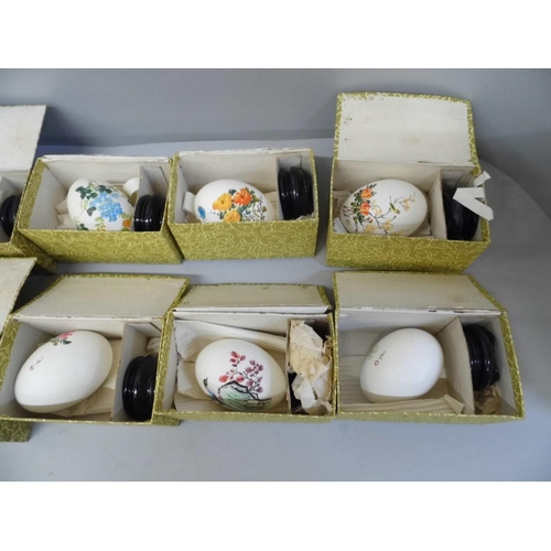 689 - Three boxes of hand painted Chinese eggs and stands (18)