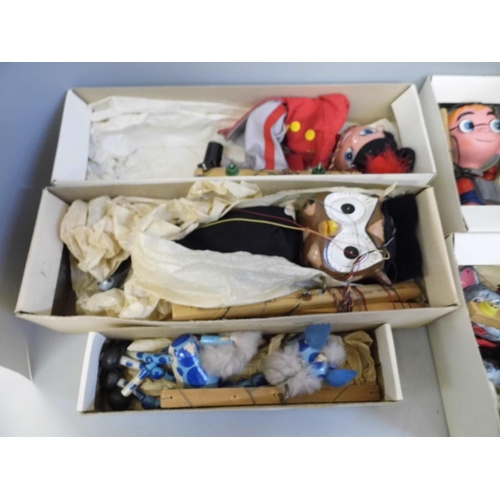 692 - A collection of six Pelham puppets; Dragon, Booster, Cat, Giraffe, Fritzi and Owl, boxed