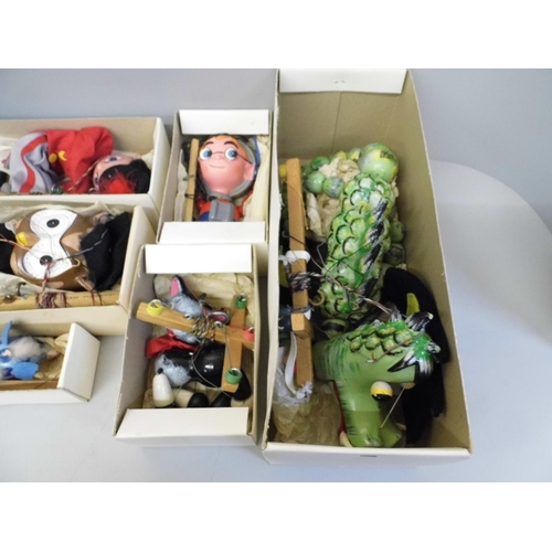 692 - A collection of six Pelham puppets; Dragon, Booster, Cat, Giraffe, Fritzi and Owl, boxed