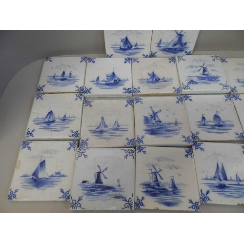 712 - A box of twenty 18th Century blue and white Delft tiles