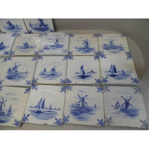 712 - A box of twenty 18th Century blue and white Delft tiles