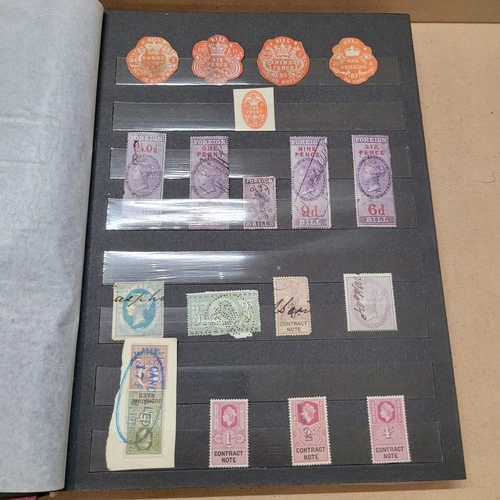 733 - Stamps; a stock book of Revenue stamps