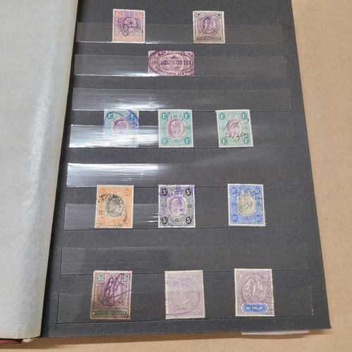 733 - Stamps; a stock book of Revenue stamps