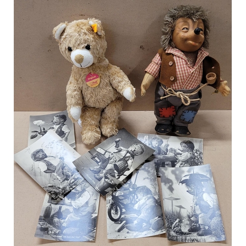 735 - A Steiff Teddy bear and a Steiff Mecki doll with accompanying postcards