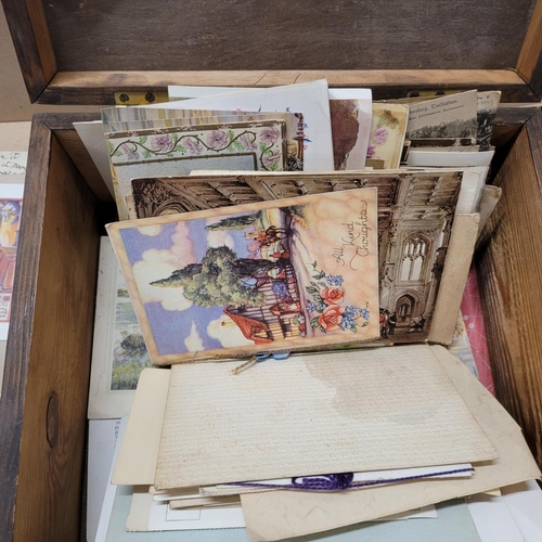 738 - A box of Edwardian and later postcards and greetings cards