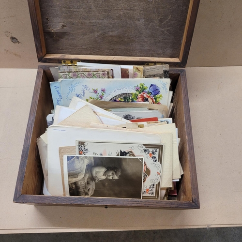 738 - A box of Edwardian and later postcards and greetings cards