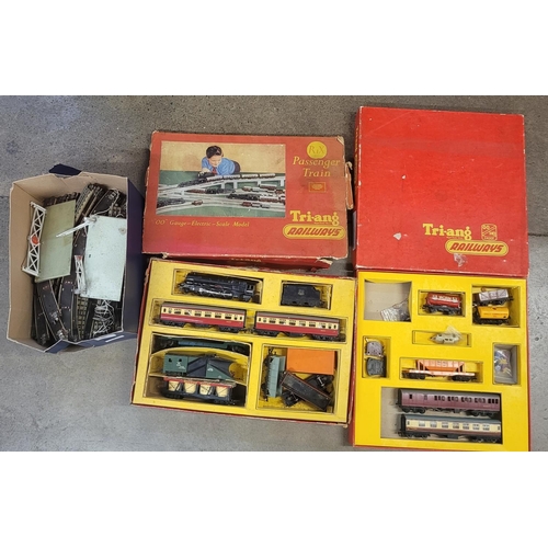 766 - 1950s Triang OO gauge set and other rolling stock, spares and over 40ft of track and level crossing