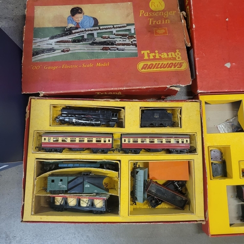 766 - 1950s Triang OO gauge set and other rolling stock, spares and over 40ft of track and level crossing