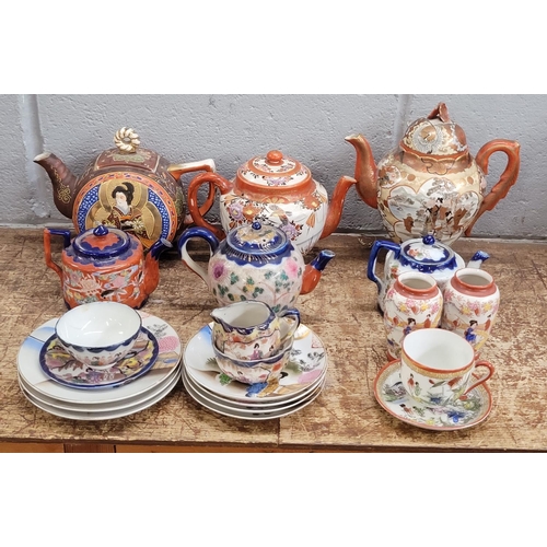 793 - Oriental teawares, Satsuma teapots, a pair of vases, saucers and tea plates