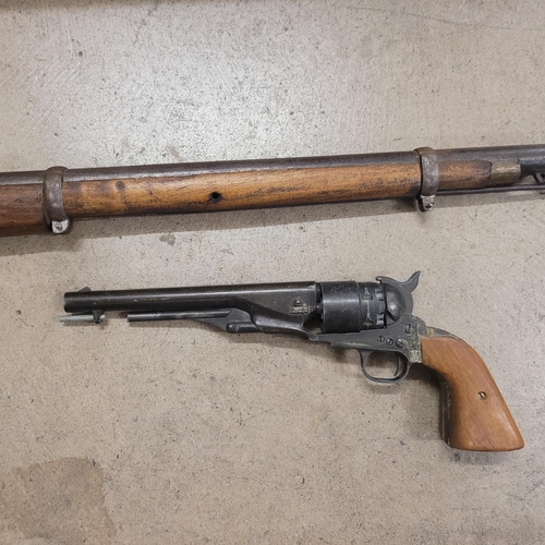 796 - An Indian two band Enfield percussion rifle and a revolver