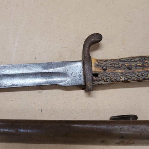 808 - A bayonet with antler handle and scabbard