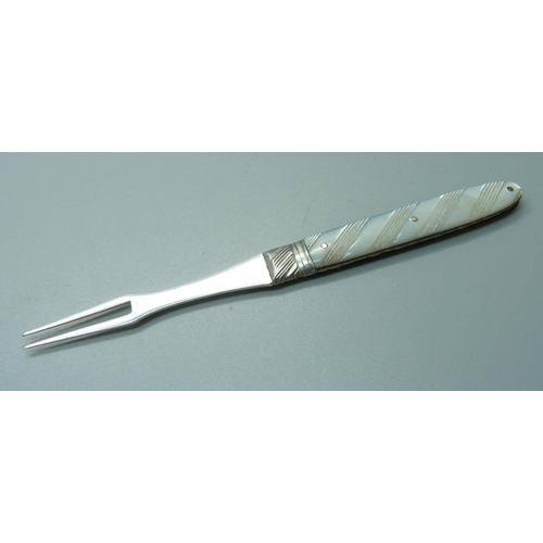 813 - A Georgian silver and mother of pearl olive fork