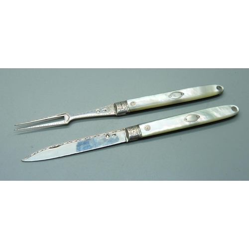 849 - A Georgian silver and mother of pearl fruit knife with matching olive fork, cased