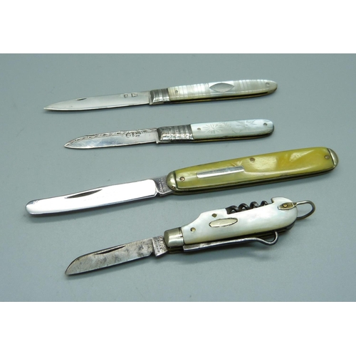 862 - Two Georgian silver and mother of pearl fruit knives, a small utility knife and one other knife