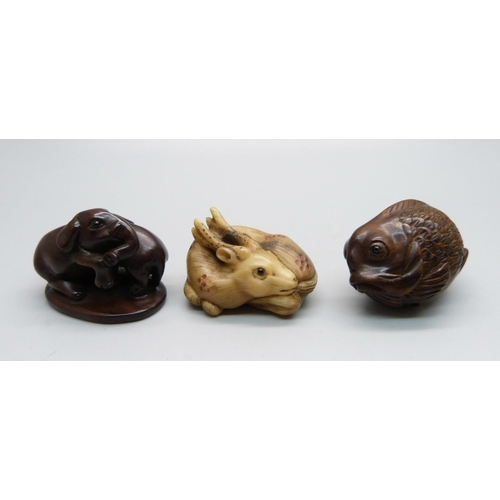 875 - Three carved netsuke, elephants, deer and fish