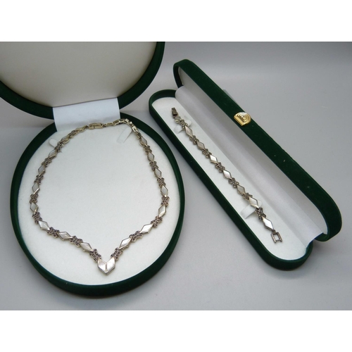 898 - A silver, mother of pearl and marcasite necklace and matching bracelet