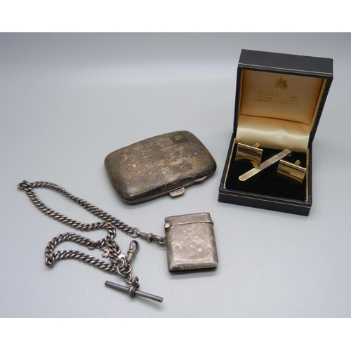 907 - A silver cigarette case, a silver Albert chain, a silver vesta case and a pair of cufflinks and a si... 