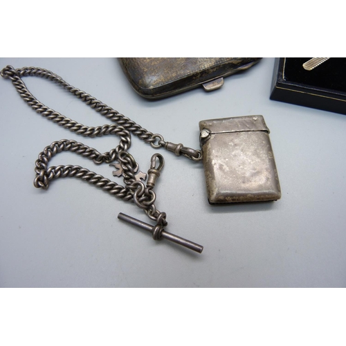 907 - A silver cigarette case, a silver Albert chain, a silver vesta case and a pair of cufflinks and a si... 