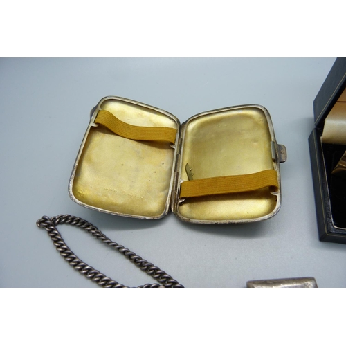 907 - A silver cigarette case, a silver Albert chain, a silver vesta case and a pair of cufflinks and a si... 