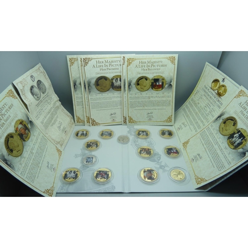 919 - A set of The London Mint Office commemorative coins, Her Majesty, A Life in Pictures, with certifica... 