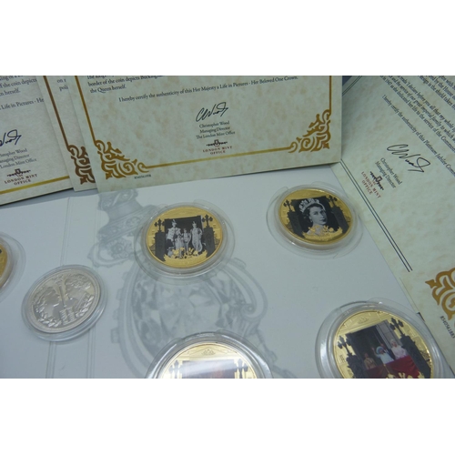 919 - A set of The London Mint Office commemorative coins, Her Majesty, A Life in Pictures, with certifica... 